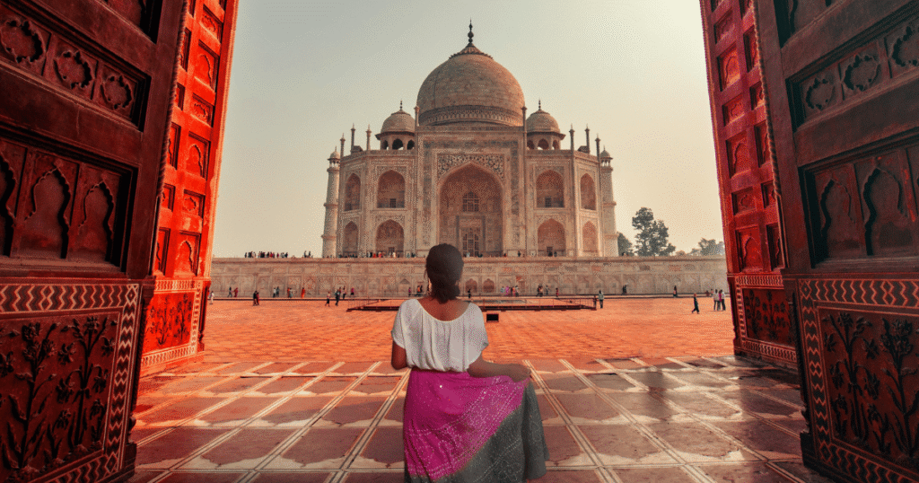 Woman travelling safely in India admiring the Taj Mahal