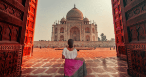 Woman travelling safely in India admiring the Taj Mahal