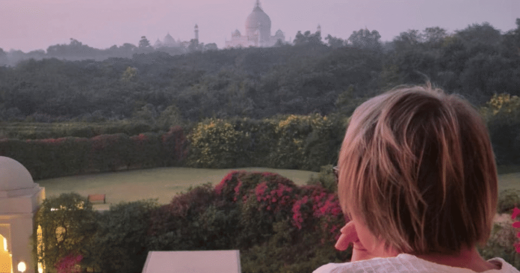 Woman enjoying a view from a luxury heritage hotel